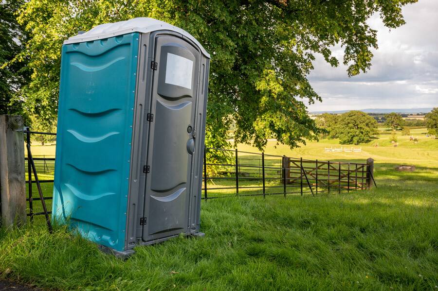 Portable Toilet in a field